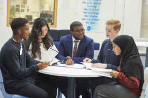 Islington sixth form students from st mary magdalene academy london chatting with deputy headteacher dami ajagbonna